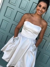 Fuchsia A-Line Strapless Satin Homecoming Dress with Beading Pockets